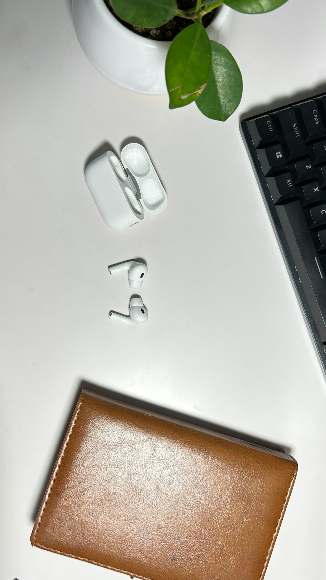 Top view of a desk with documents, financial reports and a laptop